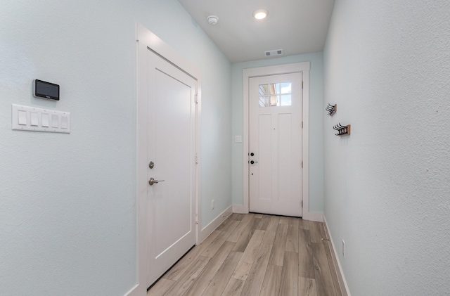 doorway with light hardwood / wood-style floors