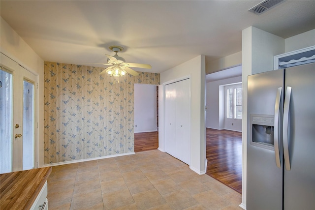 unfurnished room with ceiling fan