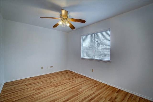 spare room featuring light hardwood / wood-style floors and ceiling fan