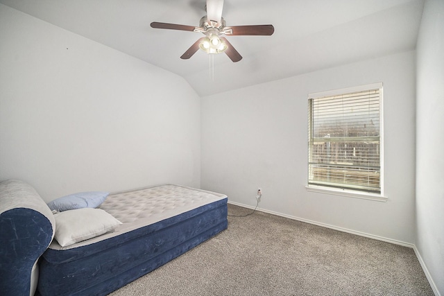bedroom with carpet floors, baseboards, a ceiling fan, and vaulted ceiling