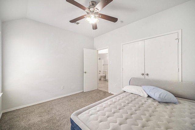 bedroom with ceiling fan, a closet, vaulted ceiling, carpet flooring, and baseboards