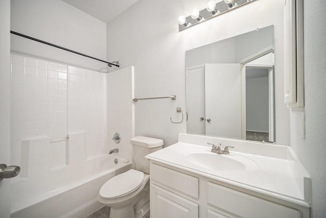 bathroom featuring toilet, bathtub / shower combination, and vanity