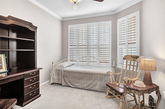 carpeted bedroom featuring ceiling fan, ornamental molding, and multiple windows