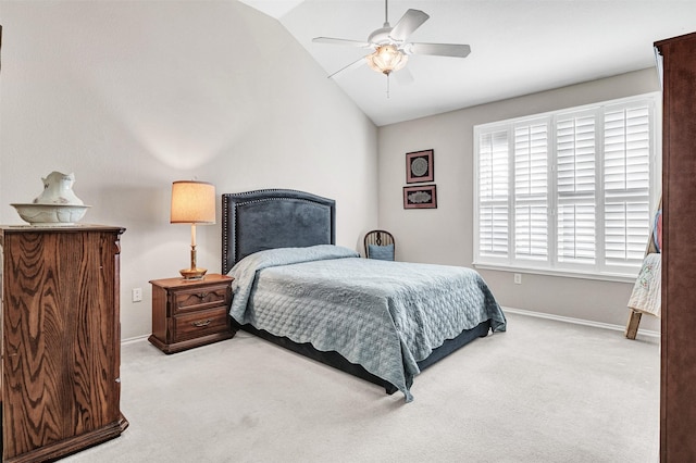 bedroom with light colored carpet, ceiling fan, and vaulted ceiling