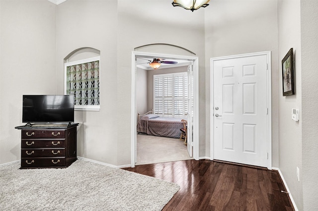 entryway with ceiling fan and dark hardwood / wood-style flooring