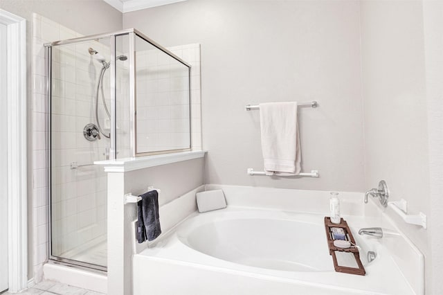 bathroom with crown molding and shower with separate bathtub