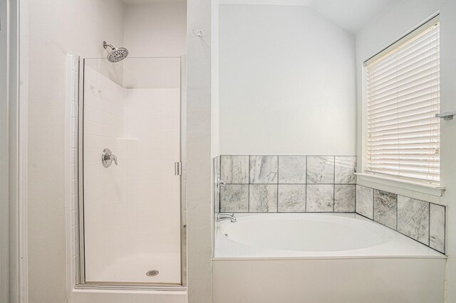 full bath with a shower stall and a garden tub
