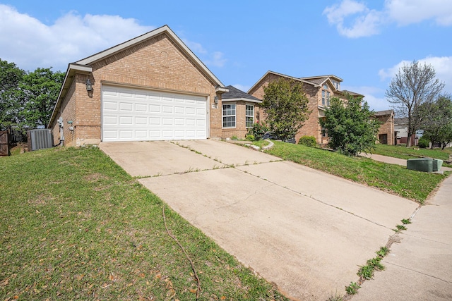 view of front facade with brick siding, central air condition unit, an attached garage, and driveway