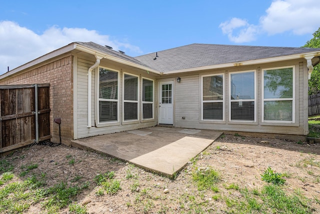 back of house with fence and a patio
