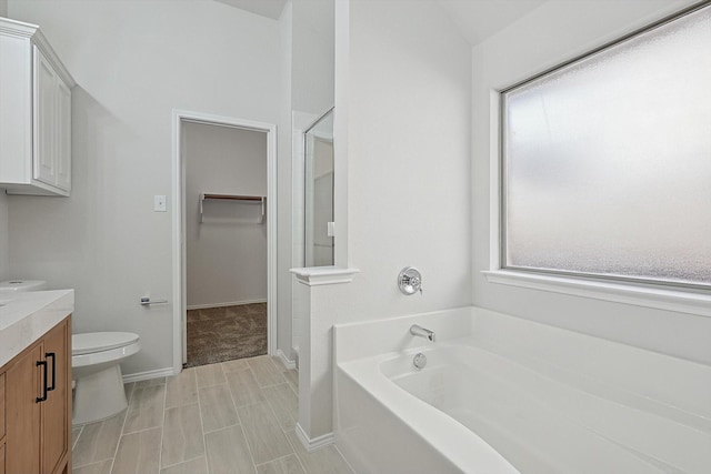 full bathroom with vanity, shower with separate bathtub, and toilet