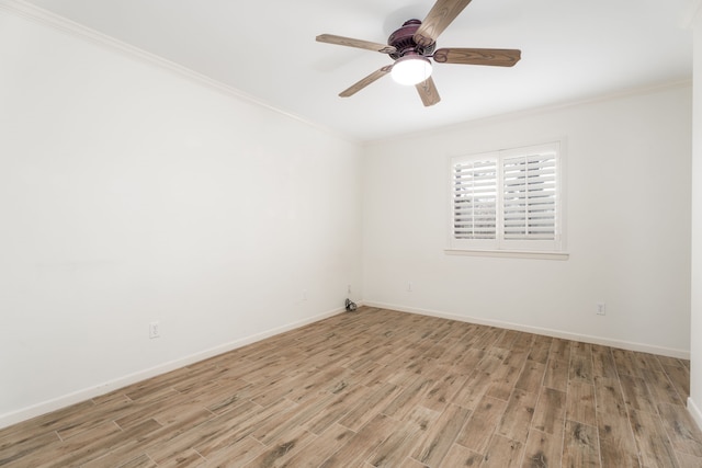 spare room with ceiling fan, crown molding, and light hardwood / wood-style floors