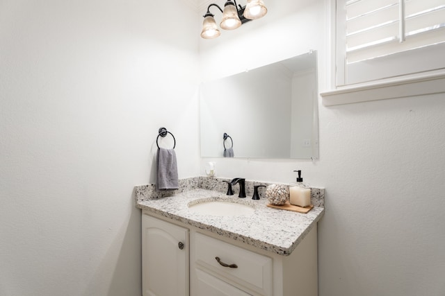 bathroom featuring vanity and an inviting chandelier