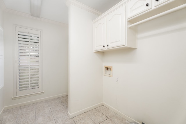 laundry room with cabinets, light tile patterned floors, crown molding, and hookup for a washing machine