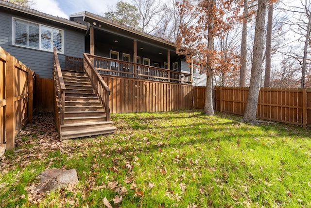 back of house with a lawn