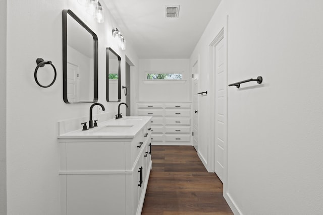 bathroom with vanity and hardwood / wood-style flooring