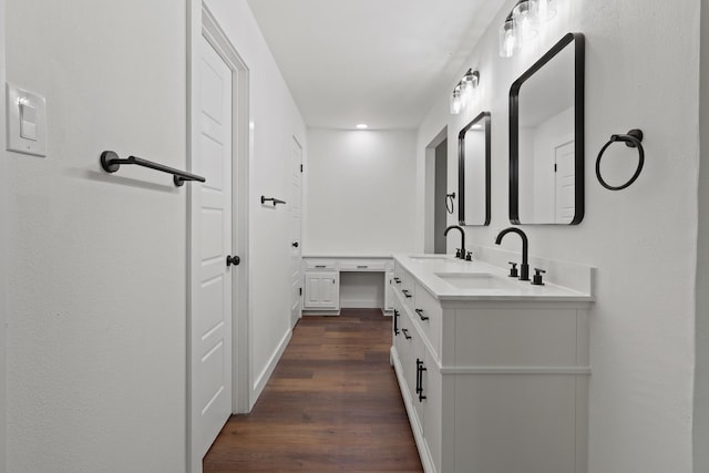 bathroom featuring hardwood / wood-style flooring and vanity