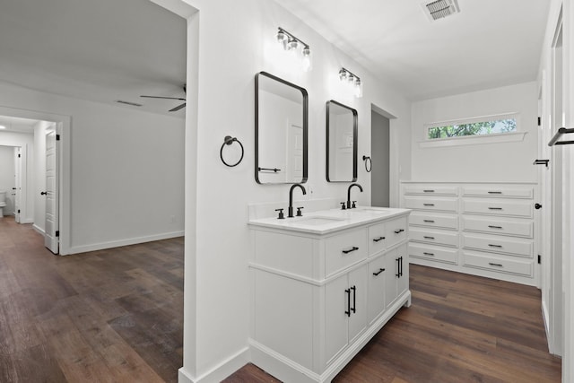 bathroom featuring ceiling fan, hardwood / wood-style floors, and vanity