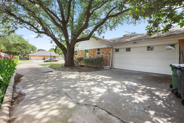 single story home featuring a garage