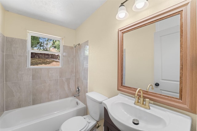 full bathroom featuring toilet, vanity, and tiled shower / bath combo