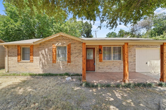 single story home featuring a garage and covered porch