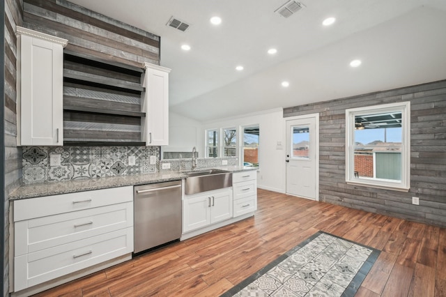 kitchen with sink, stainless steel dishwasher, and white cabinetry