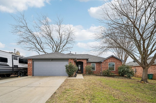 ranch-style home with a front yard and a garage