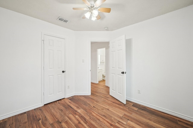 unfurnished bedroom featuring ceiling fan and wood-type flooring