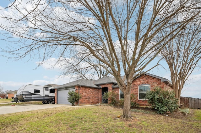 ranch-style house with a garage and a front yard