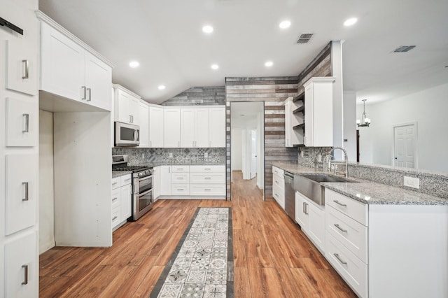 kitchen with white cabinetry and appliances with stainless steel finishes