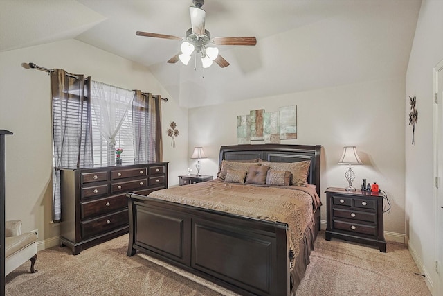 carpeted bedroom with lofted ceiling and ceiling fan