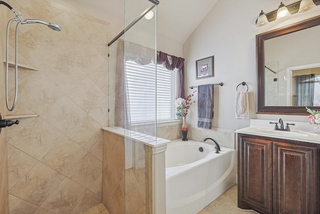 bathroom featuring plus walk in shower, tile patterned flooring, lofted ceiling, and vanity