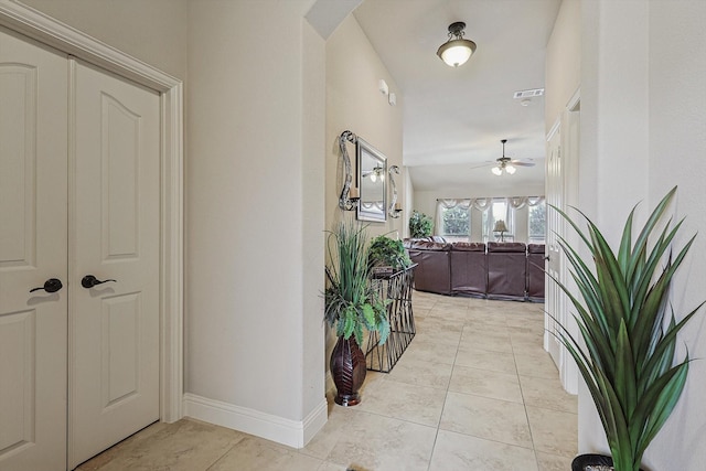 hallway with light tile patterned floors