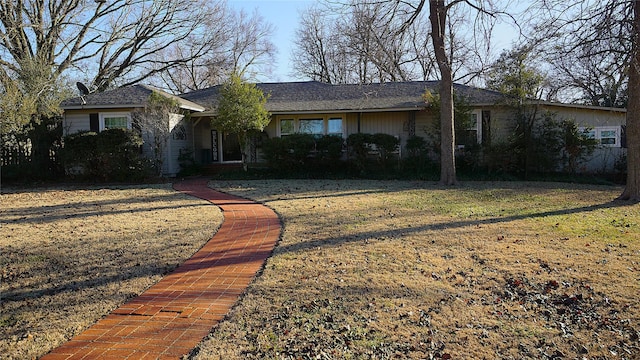 ranch-style house with a front lawn