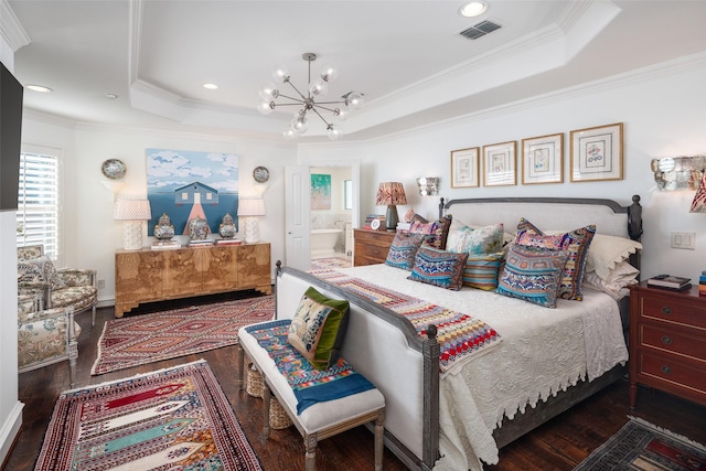 bedroom featuring visible vents, a raised ceiling, an inviting chandelier, and wood finished floors