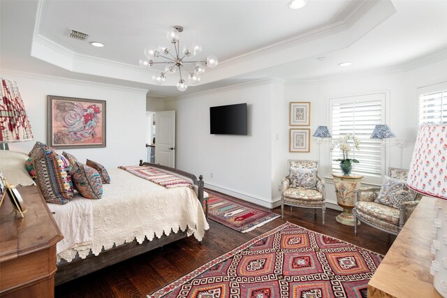 bedroom featuring a notable chandelier, visible vents, a tray ceiling, and wood-type flooring