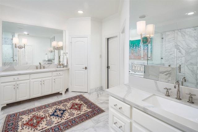 full bath with a shower stall, ornamental molding, marble finish floor, and a sink