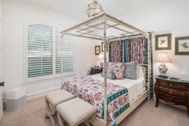 carpeted bedroom with ornamental molding