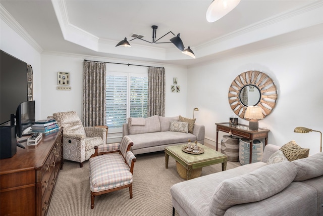 carpeted living area featuring a tray ceiling, visible vents, and crown molding