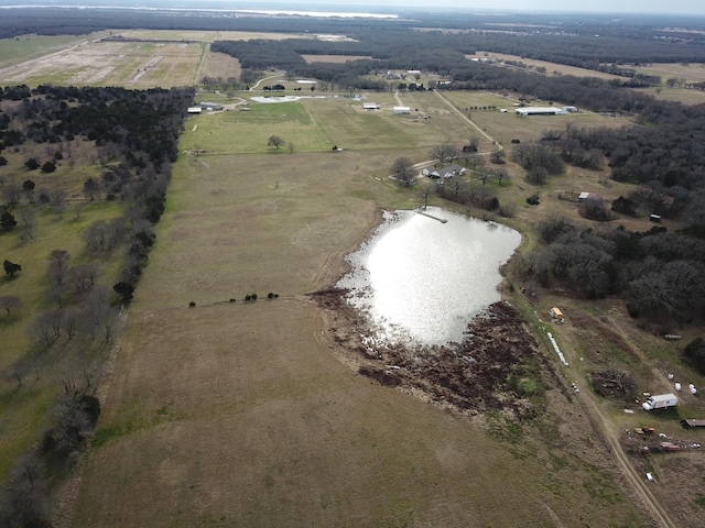 drone / aerial view featuring a rural view and a water view