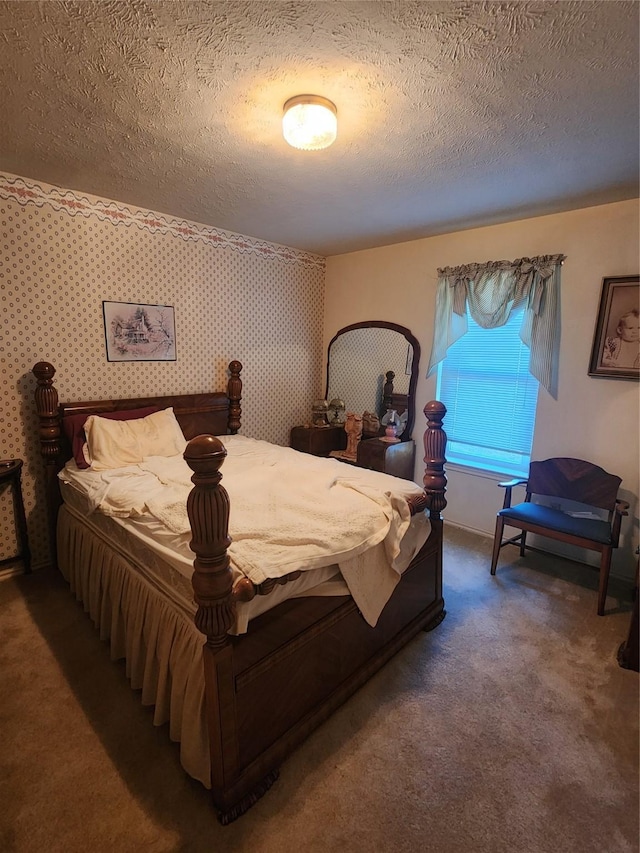 carpeted bedroom with a textured ceiling