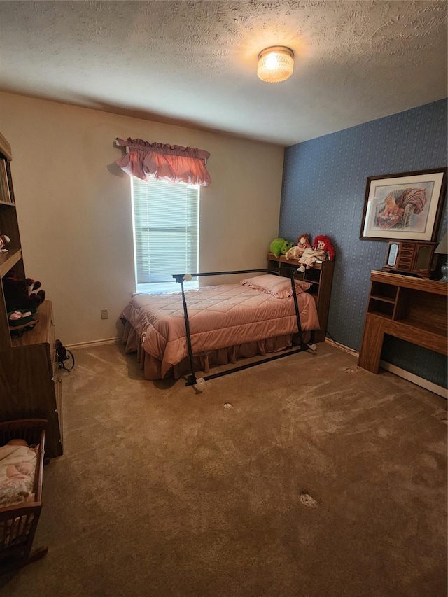 carpeted bedroom with a textured ceiling