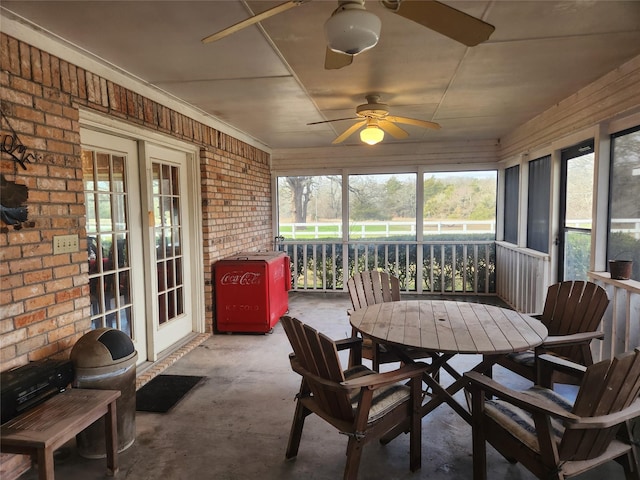 sunroom / solarium with ceiling fan