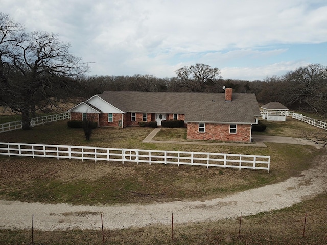 single story home featuring a front yard