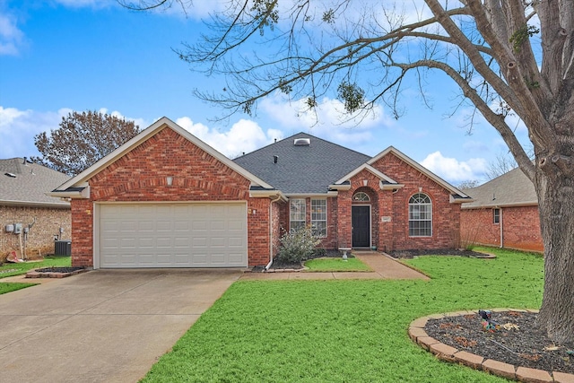 view of front of property with a front lawn, a garage, and cooling unit