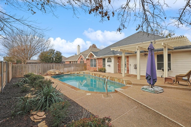 view of pool with a pergola and a patio