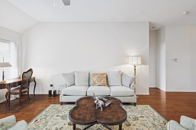 living room featuring dark wood-type flooring, lofted ceiling, and ceiling fan