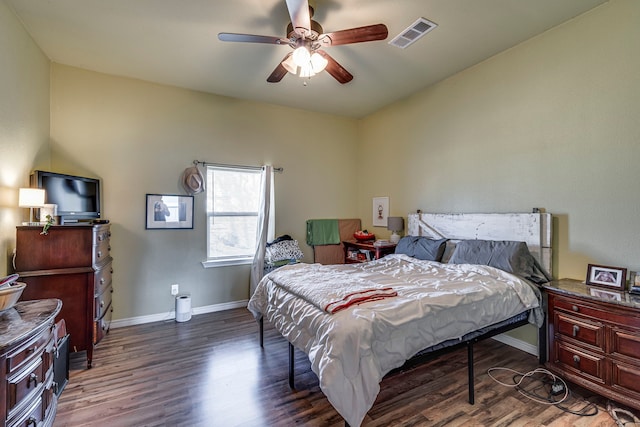 bedroom with ceiling fan and dark hardwood / wood-style flooring