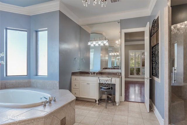 bathroom with crown molding, tile patterned floors, and vanity