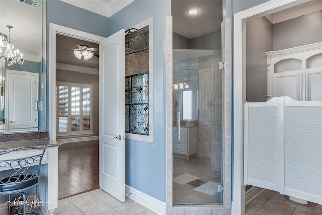 bathroom with ceiling fan, tile patterned flooring, ornamental molding, and walk in shower