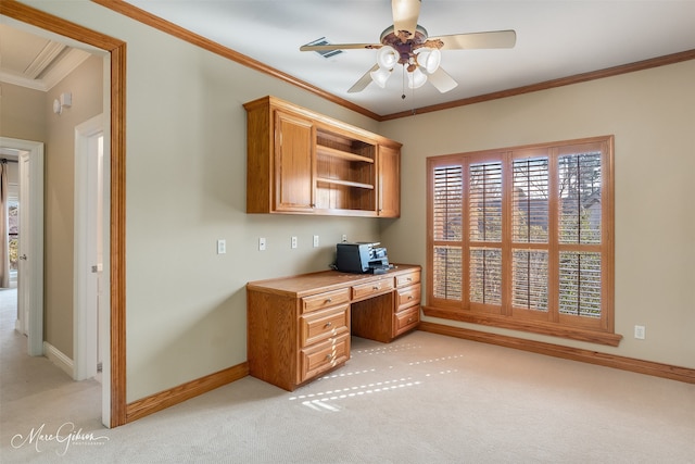 office area featuring light carpet, ceiling fan, and ornamental molding